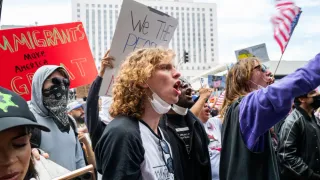 Military parade rolls through DC as 'No Kings' protesters across US decry Trump