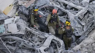 The Latest: Death toll grows as Israel and Iran trade attacks for third day