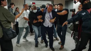 NYC mayoral candidate is arrested at immigration court after linking arms with man being detained